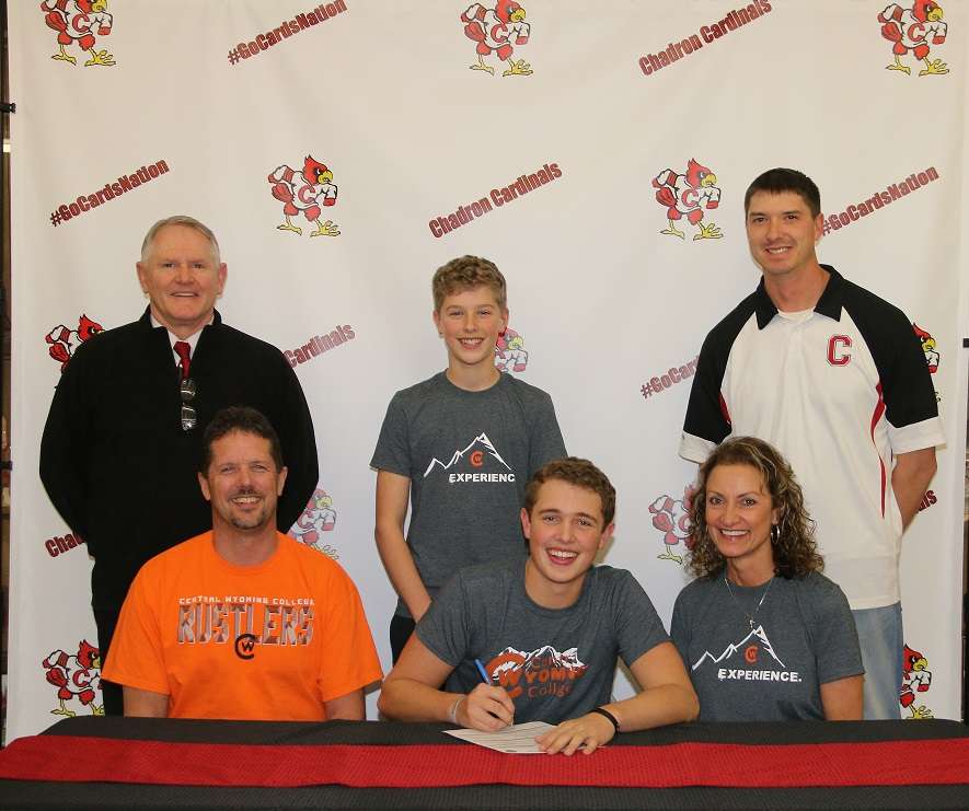 Trevor Berry signs his Letter of Intent. With him are his parents, LeeVern and Tricia. In the back, from left, are Chadron High Athletic Director Andy Pope; his brother, Broc; and his high school golf coach, C.J. Bach. Photo Courtesy: Con Marshall