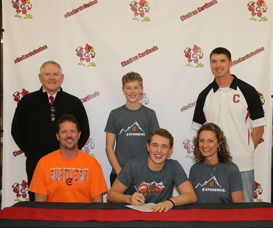 Trevor Berry signs his Letter of Intent. With him are his parents, LeeVern and Tricia. In the back, from left, are Chadron High Athletic Director Andy Pope; his brother, Broc; and his high school golf coach, C.J. Bach.&nbsp; Photo Courtesy: Con Marshall