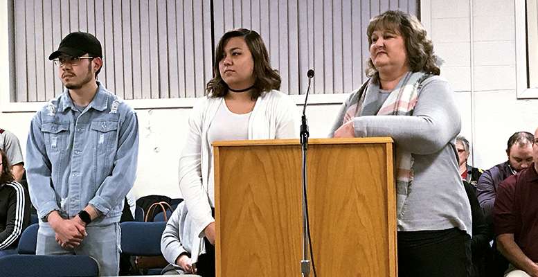 Amy Nguyen, center, Learning Center student, was honored with the Student Spotlight Award at the Hays school board meeting Monday night.
