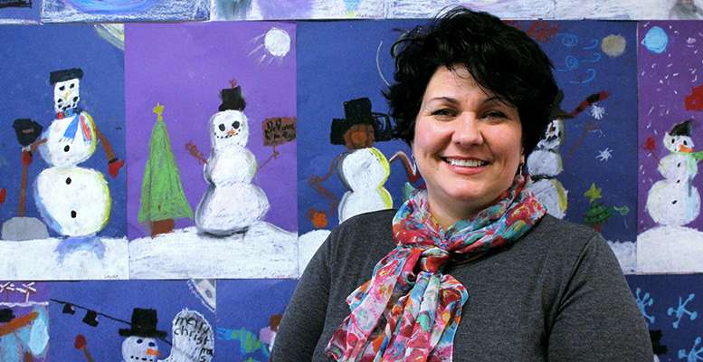 Teresa Gross, art teacher at Wilson and Lincoln elementary schools, stands in front of student art at Wilson. Gross has been named the December Hays Post Teacher of the Month.