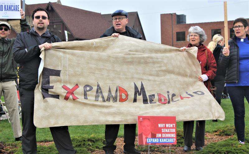 Protesters last year targeted Senate Majority Leader Jim Denning for blocking Medicaid expansion. Now he and Gov. Laura Kelly have settled on a compromise.&nbsp; Jim McLean / Kansas News Service 