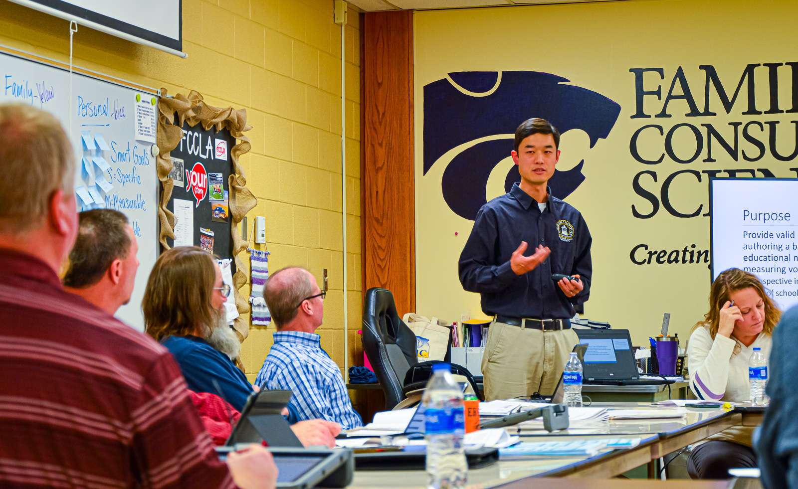 Docking Institute of Public Affairs Assistant Director Jian Sun shares bond survey results with the Ellis Board of Education.