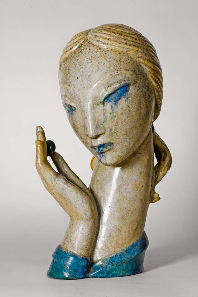 <b>"Girl with Olive" is a 1932, glazed stoneware by Waylande Gregory. The work, 14 1/2 x 8 x 6 1/2 inches, is part of a private collection.</b> Photo courtesy KSU