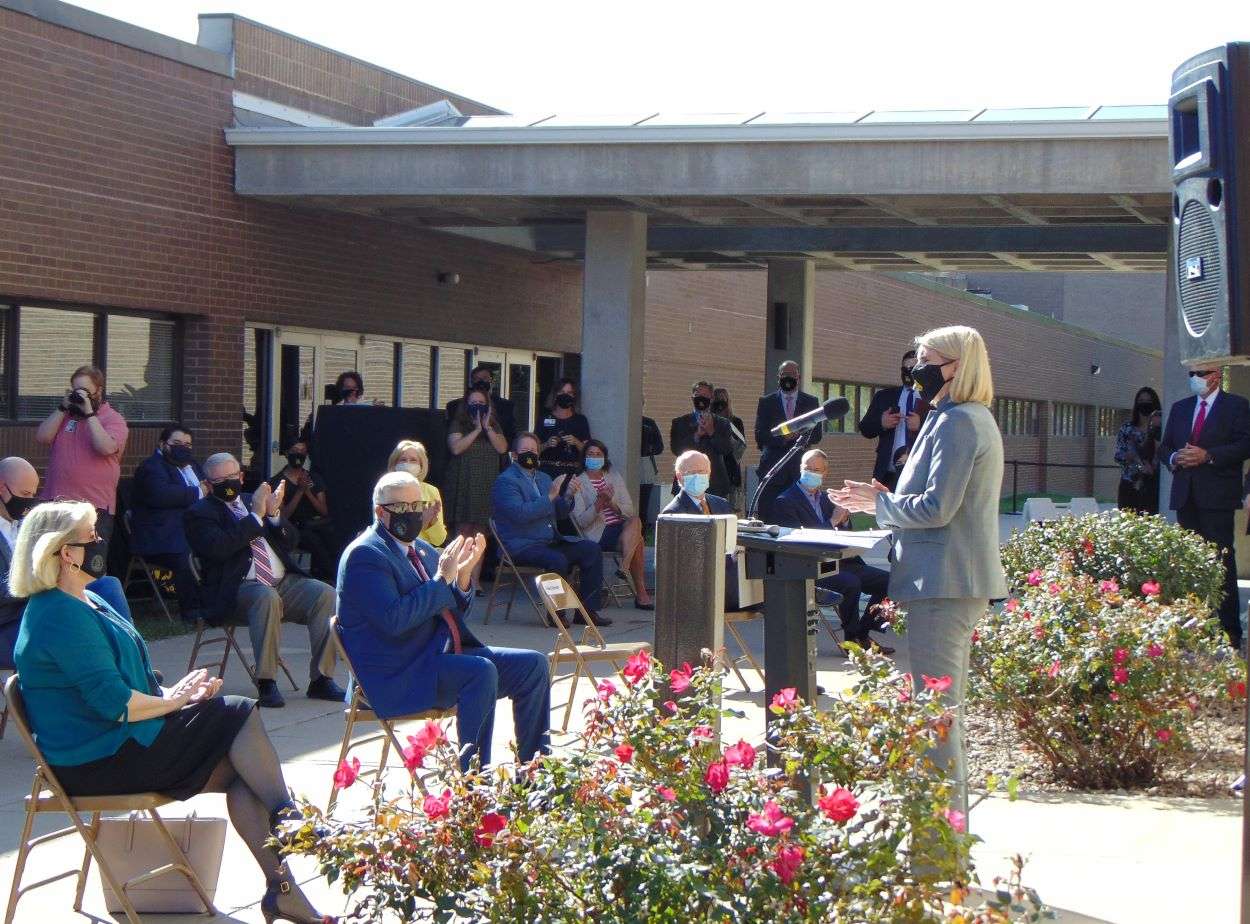 MWSU Interim President Elizabeth Kennedy speaks before the ribbon cutting ceremony as Gov. Mike Parson and 1st Lady Teresa Parson applaud/Photo by Brent Martin