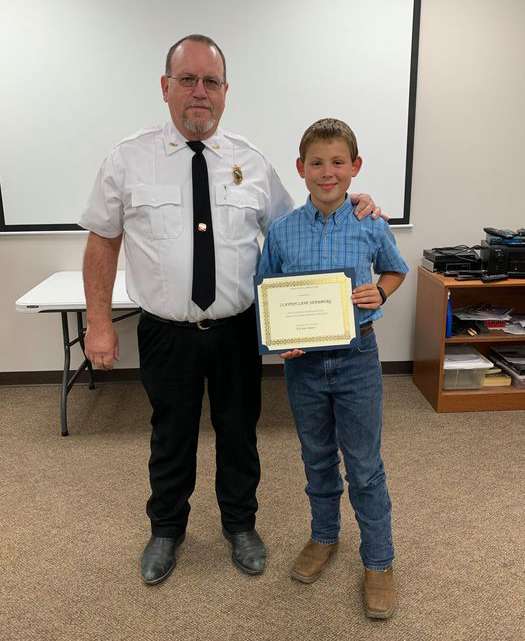 <b>Ottawa County Fire District No. 4 Chief Mark Whitesell presented Clayton Shamburg with a certificate recognizing his efforts to help prevent a house fire on Sept. 29.</b> Photo courtesy Ottawa County Fire District No. 4