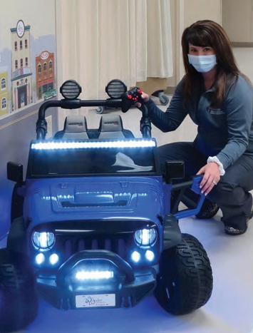 Dani VonFeldt, Ambulatory Surgery RN, gets a remote-operated vehicle ready to transport a pediatric patient. Courtesy photo