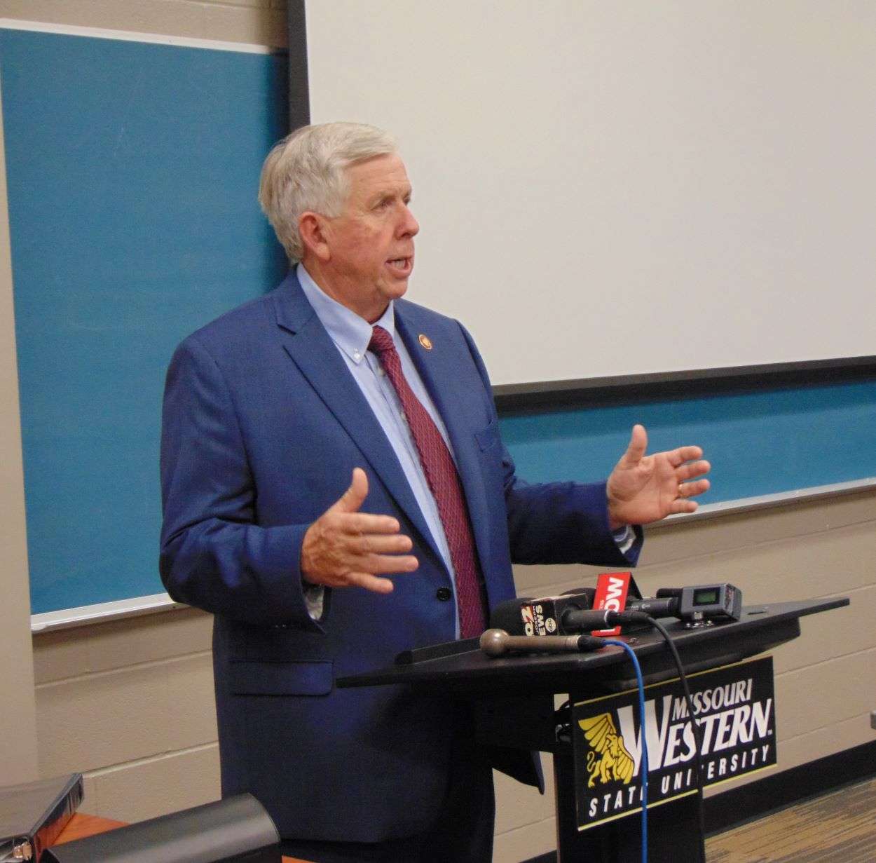 Gov. Mike Parson speaks with reporters at MWSU/Photo by Brent Martin