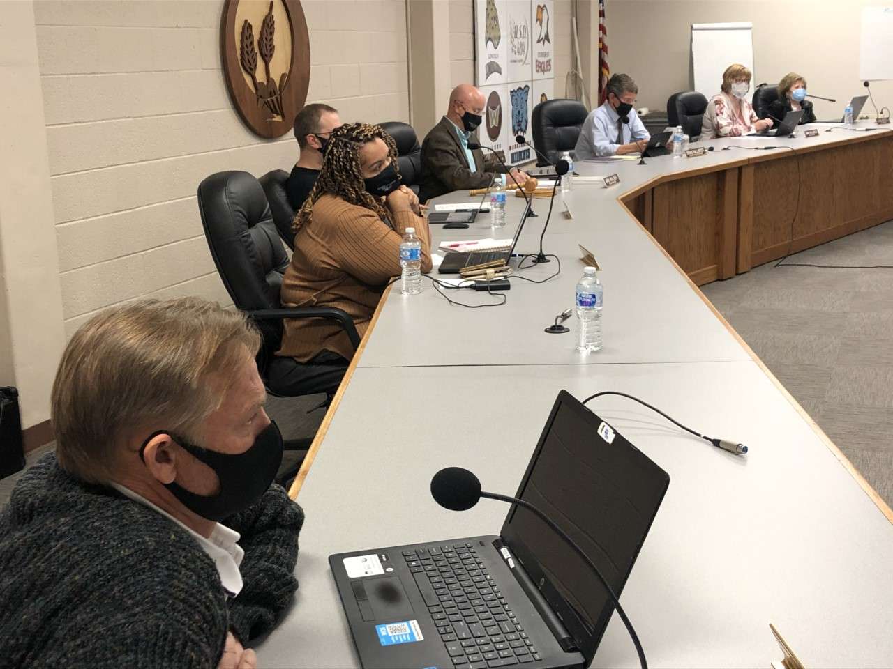 Hays USD 489 school board members voted unanimously in a special meeting Monday night to approve reduction of COVID-19 quarantine from 14 days to 7 days for students or staff identified as close contacts in the school environment, and all parties were wearing masks.
