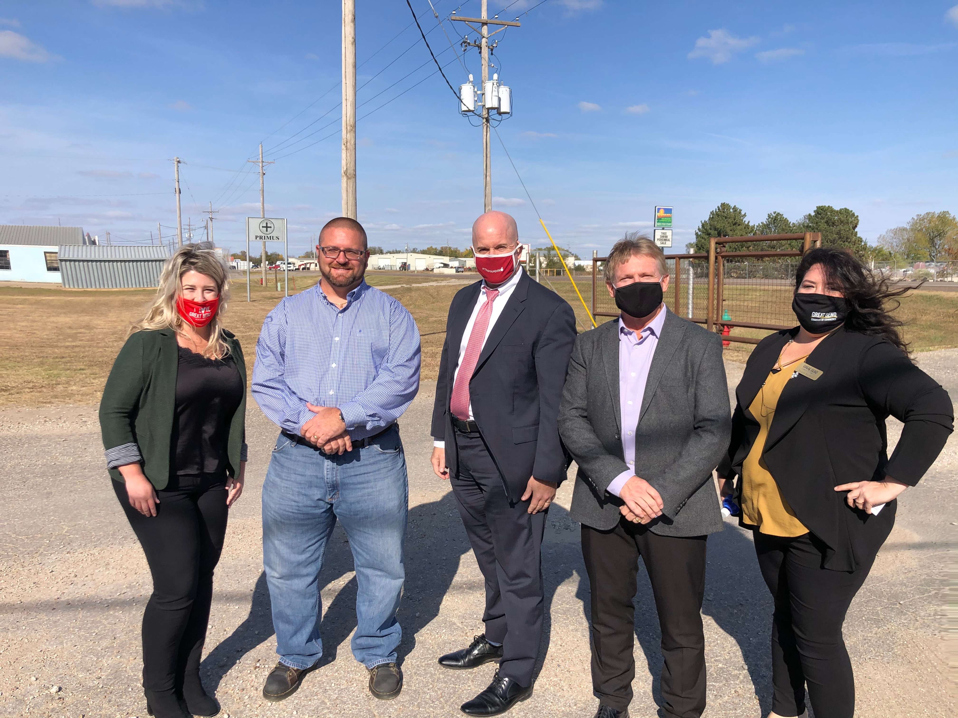 Local and state officials gather outside Primus Sterilizer after a tour of the facilities. From left to right are: Sara Hayden, Great Bend Economic Development president; Joe Law, Primus plant manager; Bill Murphy and Tim Zimmerman, both of the Kansas Department of Commerce; and Megan Barfield, Great Bend Chamber of Commerce president/CEO.