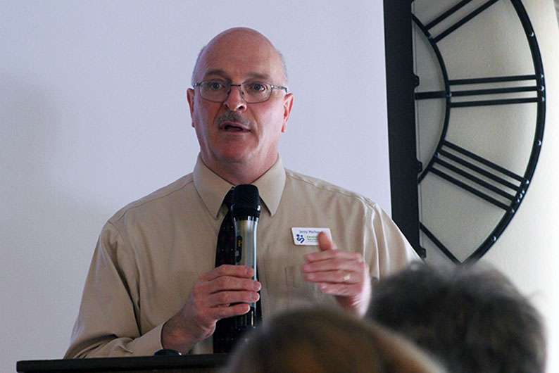 Jerry Michaud, DSNWK executive director, talks to Hays Chamber members Friday about the challenges the agency has faced during COVID-19.