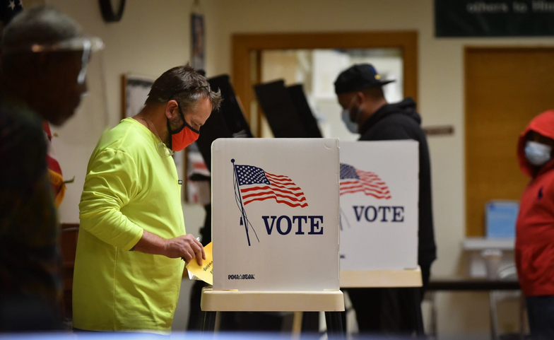 Voters in the final hour of Tuesday's election cast ballots at Olivet Institutional Baptist Church in Kansas City, Kansas. Carlos Moreno/KCUR 89.3