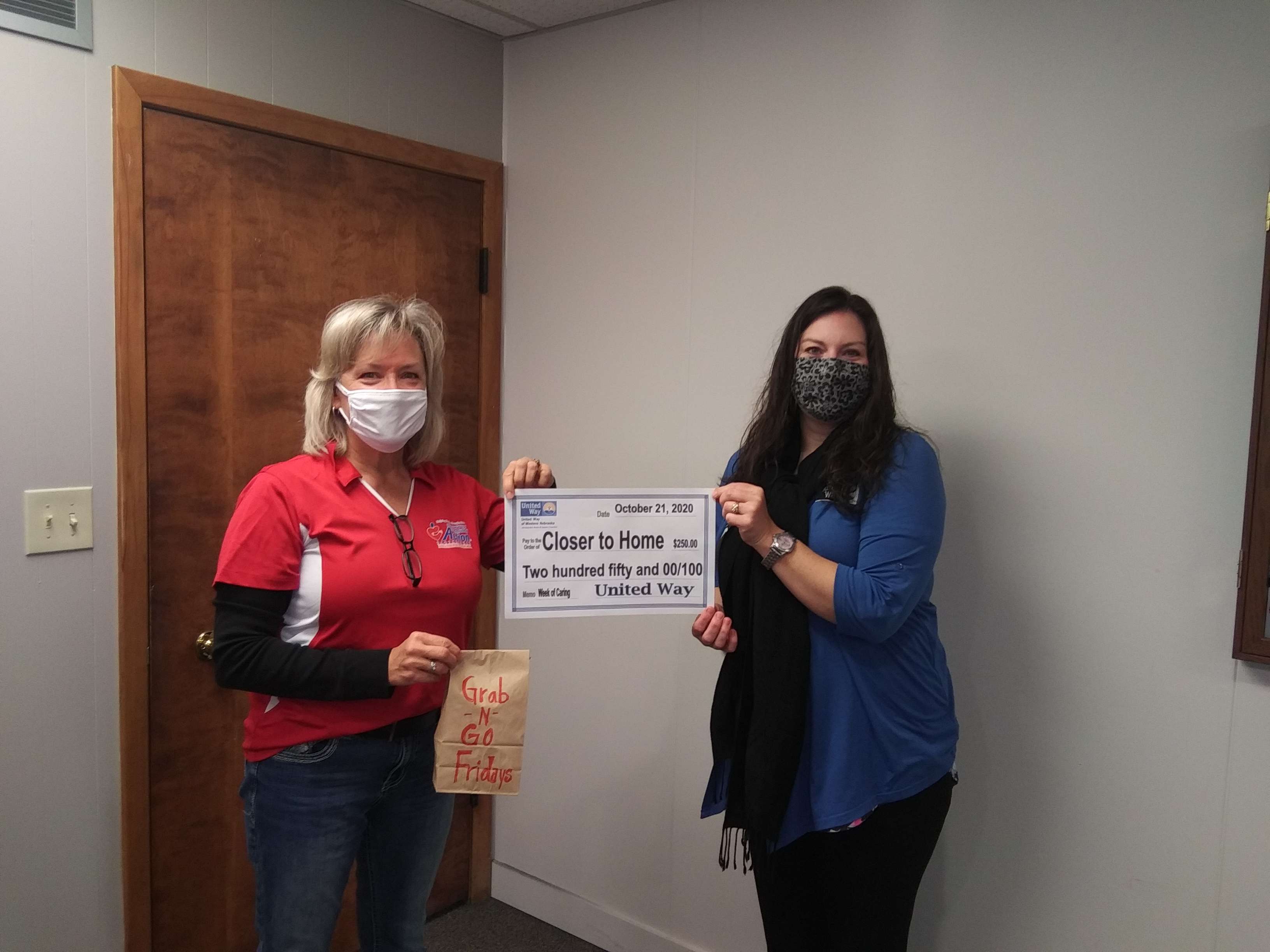 Rachel Johnson (Closer to Home Committee President) and Karen Benzel (United Way Director)