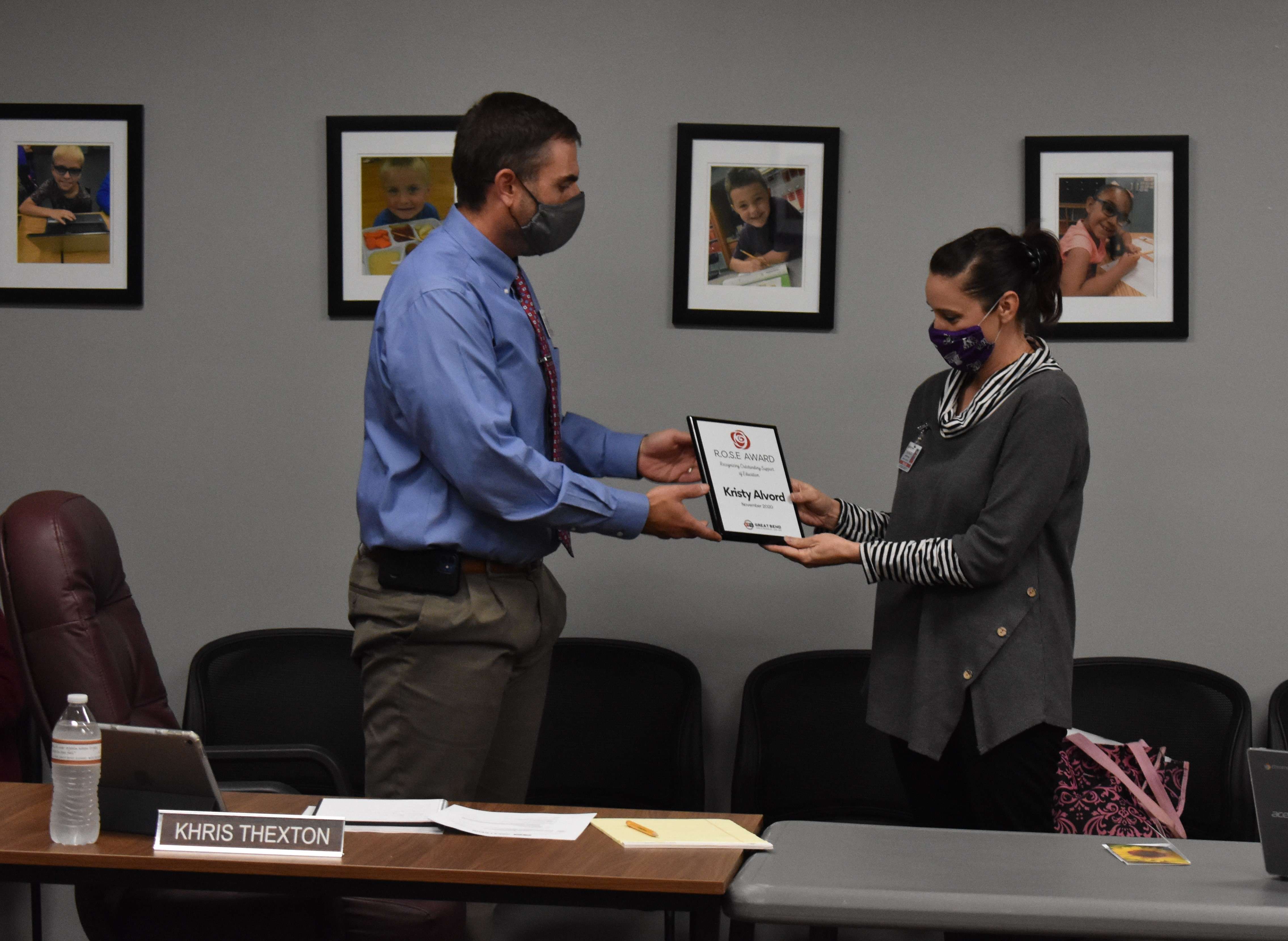 USD 428 Food Service Director Kristy Alvord (right) accepts the Rose Award from USD 428 Superintendent Khris Thexton at the USD 428 Board of Education meeting Nov. 9, 2020.