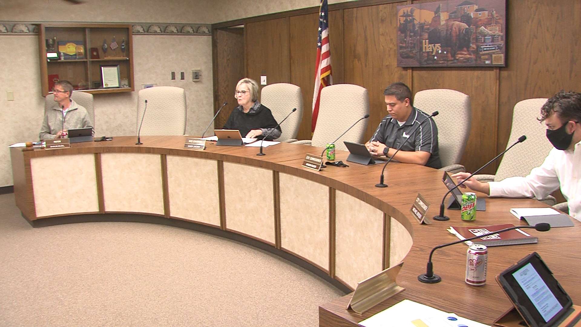 A family friend of Hays Mayor Shaun Musil, left, died this week of COVID-19.
