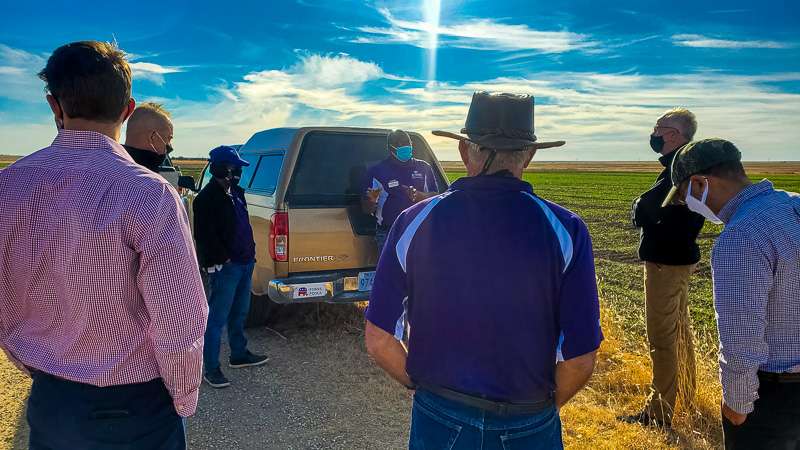 U.S. Sen. Jerry Moran, R-Kan., visits with K-State Agriculture Research Center scientists Friday about recent research into cover crop use.