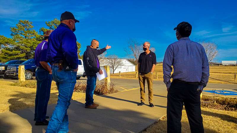 Before leaving for an impromptu tour of some of the K-State Agriculture Research Center operations, Moran speaks with business manager Spencer Casey and staff at the main office of the research station in Hays.