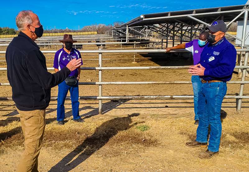 U.S. Sen. Jerry Moran, R-Kan., visits with K-State Agriculture Research Center beef cattle scientist John Jaeger about weening and cattle yield research with entomologist J.P. Michaud and soil scientist Augustine Obour.