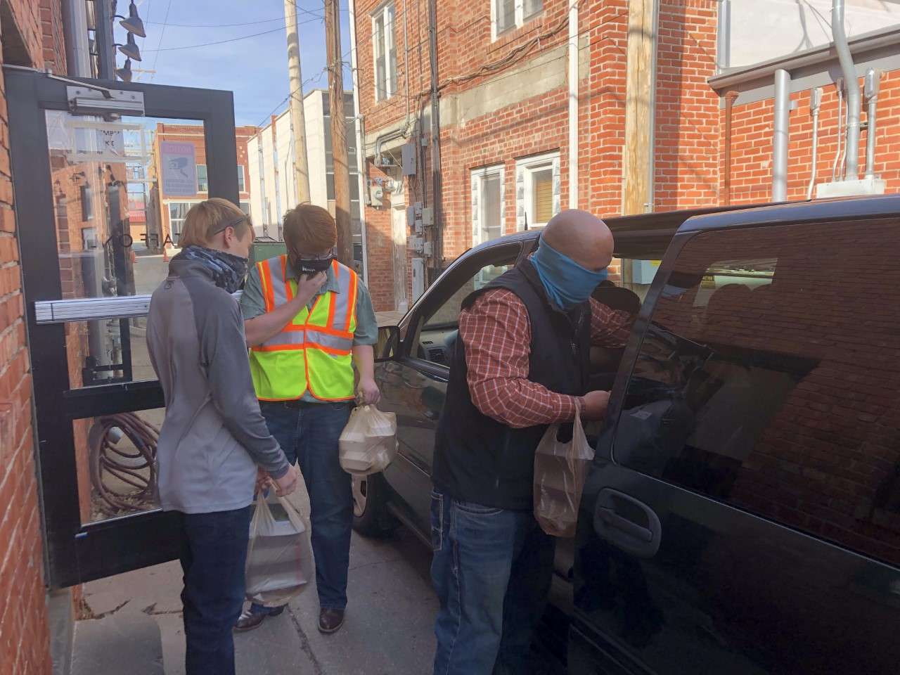 Drivers with large orders of as many as 45 dinners picked up their meals from Gella's back door in the alley.