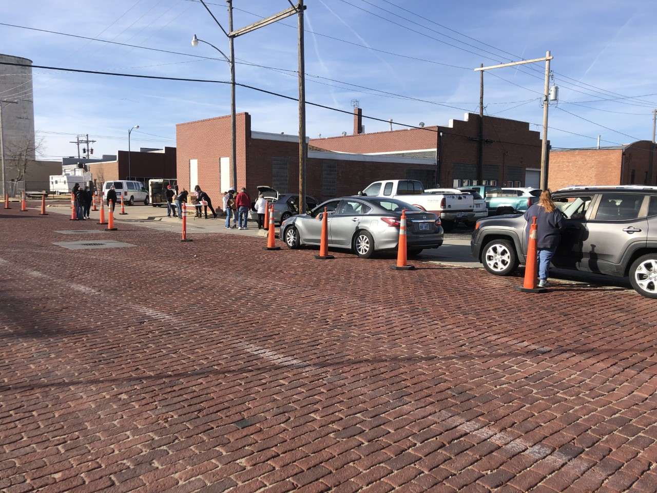 Vehicles begin lining up Thursday to pick up Thanksgiving dinners. 