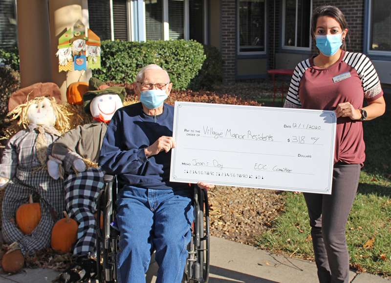 <i><b>Pictured from left are Norman Helmke, Village Manor resident, and Ashley Hernandez, EOC committee member. </b>Photo courtesy MHS</i>