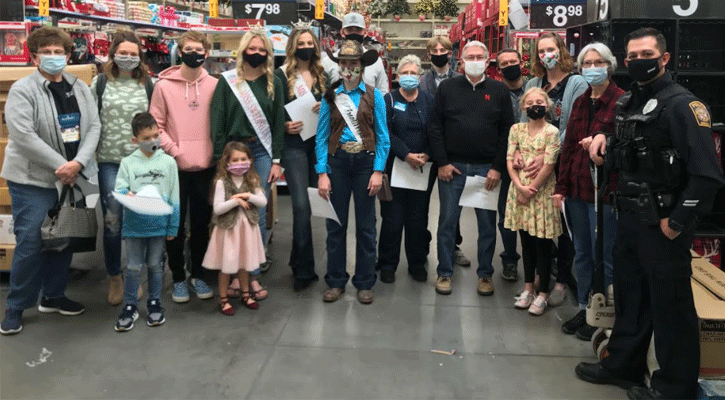 Officer Matt Elder and his team of Santa Cop shopping volunteers.