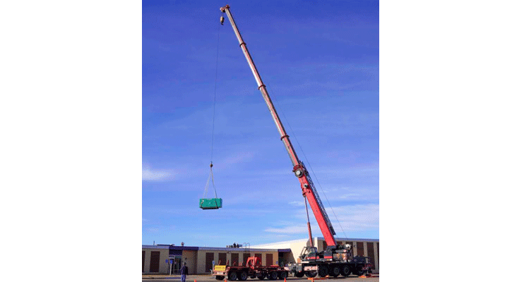 A crane lifts a generator onto the W.W. Wood Building at North Platte Community College’s North Campus Tuesday afternoon.
