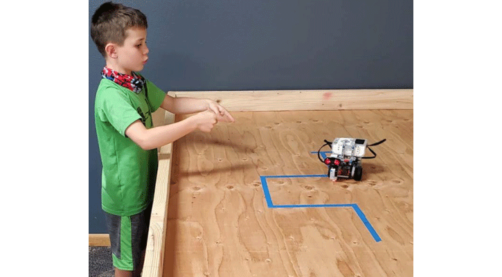 <i>Alex Brinkema, of Ogallala, tries out a robot he programmed through a LEGO MINDSTORMS class at the MPCC Imperial Campus.</i>