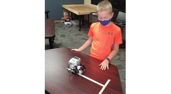 <i>Clayson Thayer, of Champion, tries out a robot he programmed through a LEGO MINDSTORMS class at the MPCC Imperial Campus.</i>