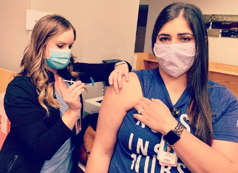 Trina Williams, RN, who typically works with orthopedic patients, felt called to serve COVID-19 patients since the beginning of the pandemic. She got her first COVID-19 vaccine dose Tuesday -photo courtesy Ascension Via Christi