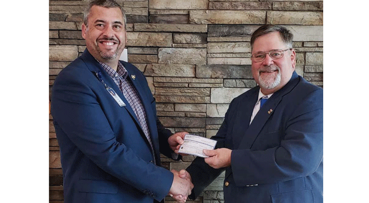 <i>MPCC President Ryan Purdy</i><i> accepts a check for $10,000 from Bill Hoyt, member of the Nebraska Public Power District Board of Directors.</i><i>The funds were raised through the Wells Fargo Nebraska Open golf tournament in Columbus in September and will be used for scholarships for electrical and engineering students.</i>