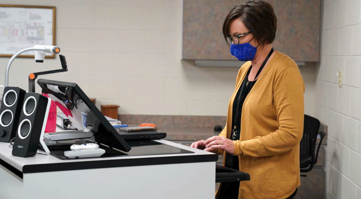 <i>Jimi Cole, Mid-Plains Community College business instructor, prepares notes for a class. Cole has been selected to receive NISOD’s Excellence in Teaching award.</i>