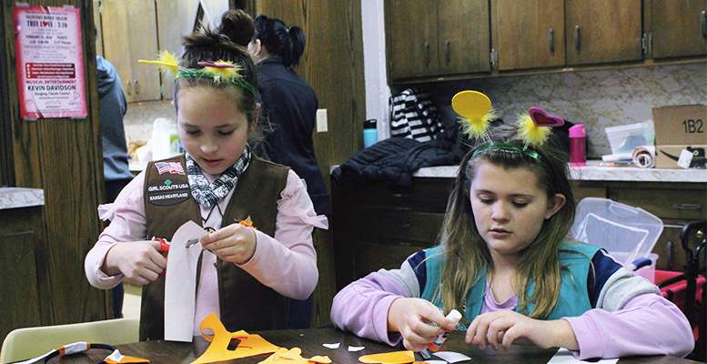 From Left: Jazlin Lewis, 9, Brownie Girl Scout, and Luca Albers, 10, Junior Girl Scout, both of Hays, make fox Valentines for veterans at the Cookie Kickoff Sunday in Hays.