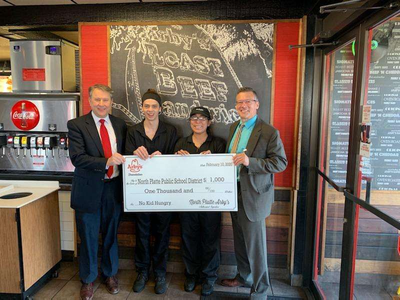 Arby's presented&nbsp; North Platte Public Schools Director of Business and Finance Stewart Simpson and Superintendent Dr. Ron Hansen a check for the schools food pantry. Dr. Ron Hansen said that they serve 70+ kids who don't receive a meal daily.&nbsp;