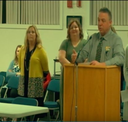 HMS principal Tom Albers and a schedule committee give a presentation on a proposed new HMS class schedule at the school board meeting Monday night.