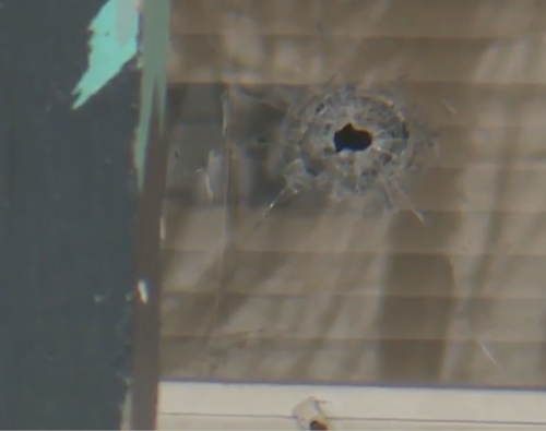 Bullet holes in the house from the drive-by shooting -<a href="https://www.kmbc.com/article/kcpd-officer-uses-tourniquet-helps-save-girl-injured-in-drive-by-shooting/31087910">image courtesy KMBC TV</a>