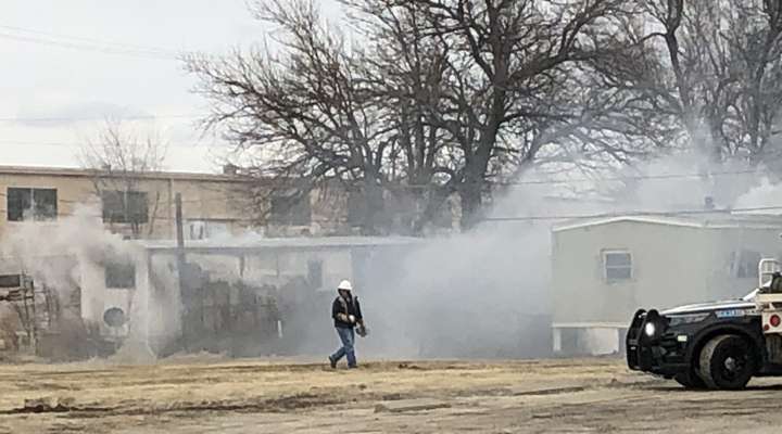 <b>Smoke pours from the window of a trailer home just east of South Broadway Boulevard.&nbsp;</b>Salina Post photo&nbsp;&nbsp;