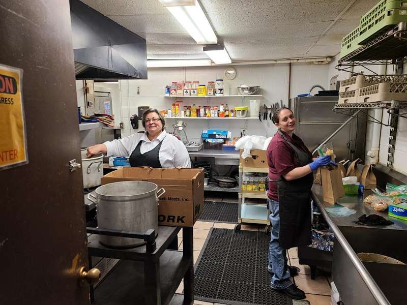 Captain Lynn Lopez, commanding officer, and Elizabeth Stang, cook, prepare a meal in the Saline County Salvation Army kitchen. Photo courtesy The Saline County Salvation Army