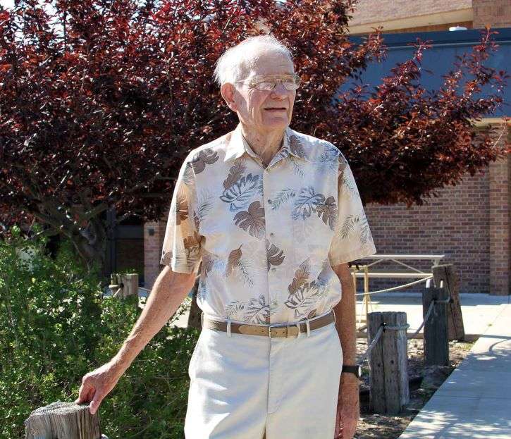 <i>Virgil Nelson stands outside the McDonald-Belton Building on NPCC’s South Campus. Nelson passed away on Monday.</i>
