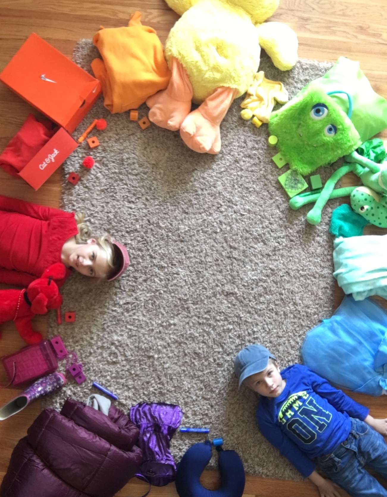 Siblings Samantha and Everett Negaard, student at Jefferson Elementary, proudly displays the results of the week-one challenge of creating an at-home color wheel.
