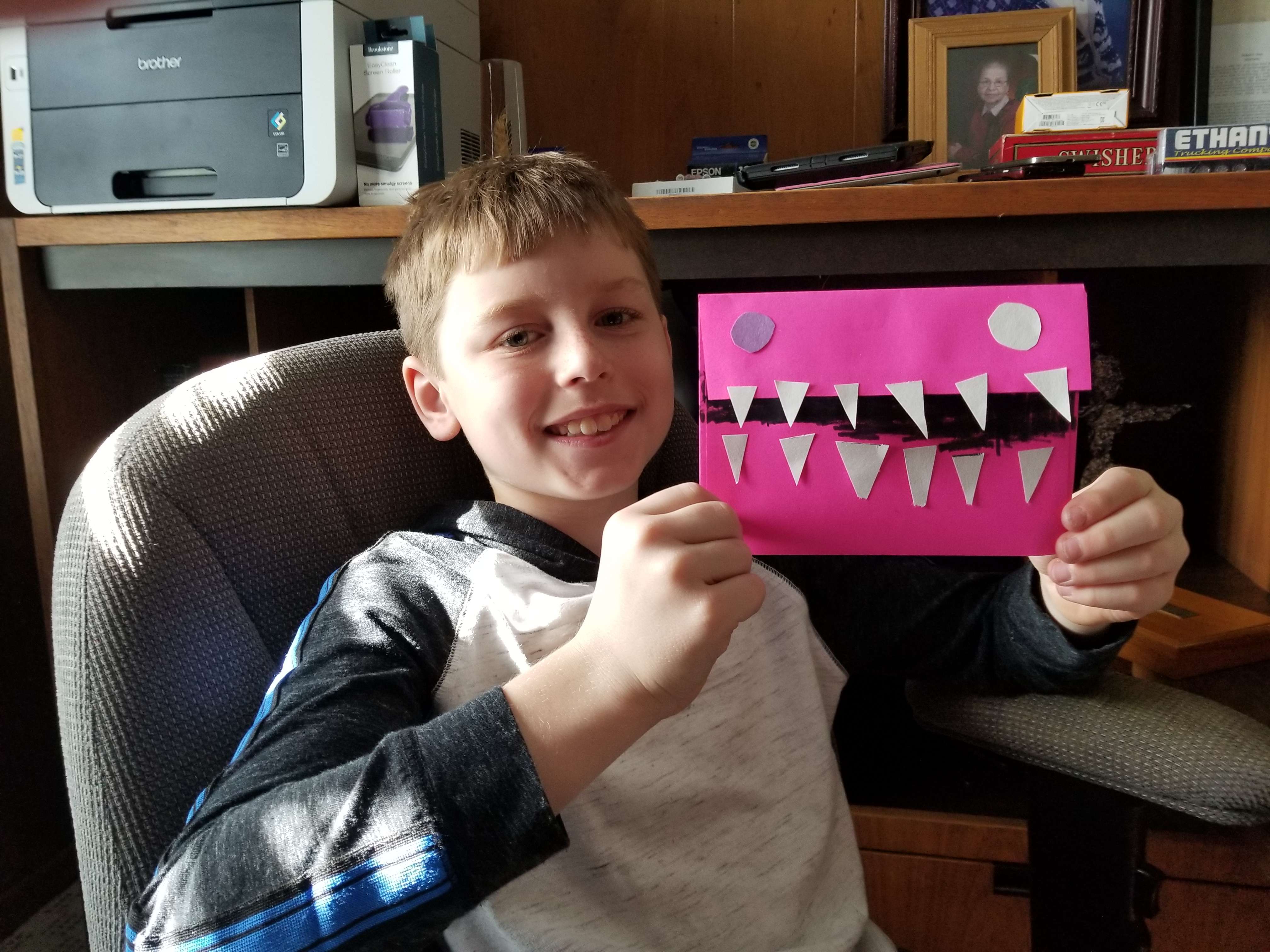 Another student from Park Elementary shows his creativity using elements found in his art kit provided by USD 428 to create a “monster envelope.”