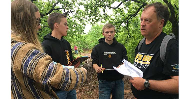 Hays High ag teacher Curt Vajnar with students at the&nbsp;National Land Practice in 2019. Vajnar will retire at the end of the school year after 31 years as a teacher at HHS.