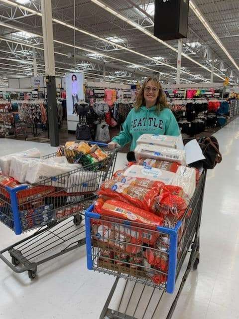 Terri Braun with groceries for people suffering from mental illness. Money for the food was donated by the WWL. Courtesy photo