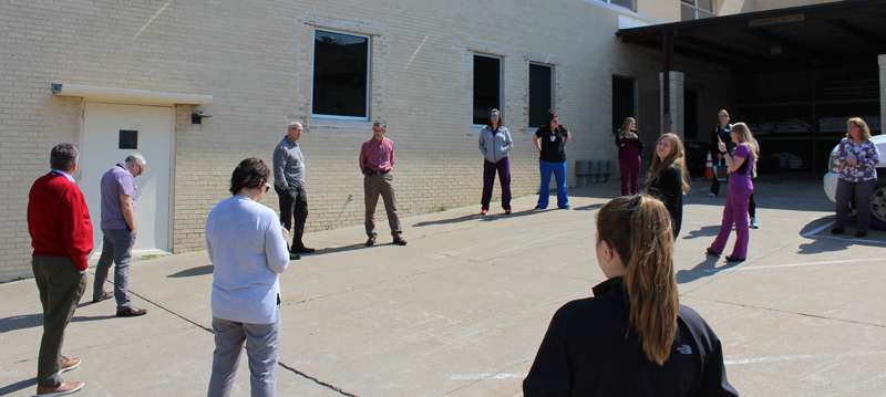<b>MHS friends and colleagues gathered outside -- at a safe distance -- for Sheern's retirement reception.</b>