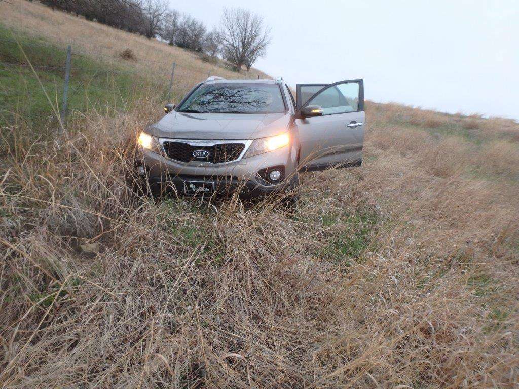 <b>The Kia Sorento ended up next to the fence in the north ditch.</b> Photo courtesy Saline County Sheriff's Office