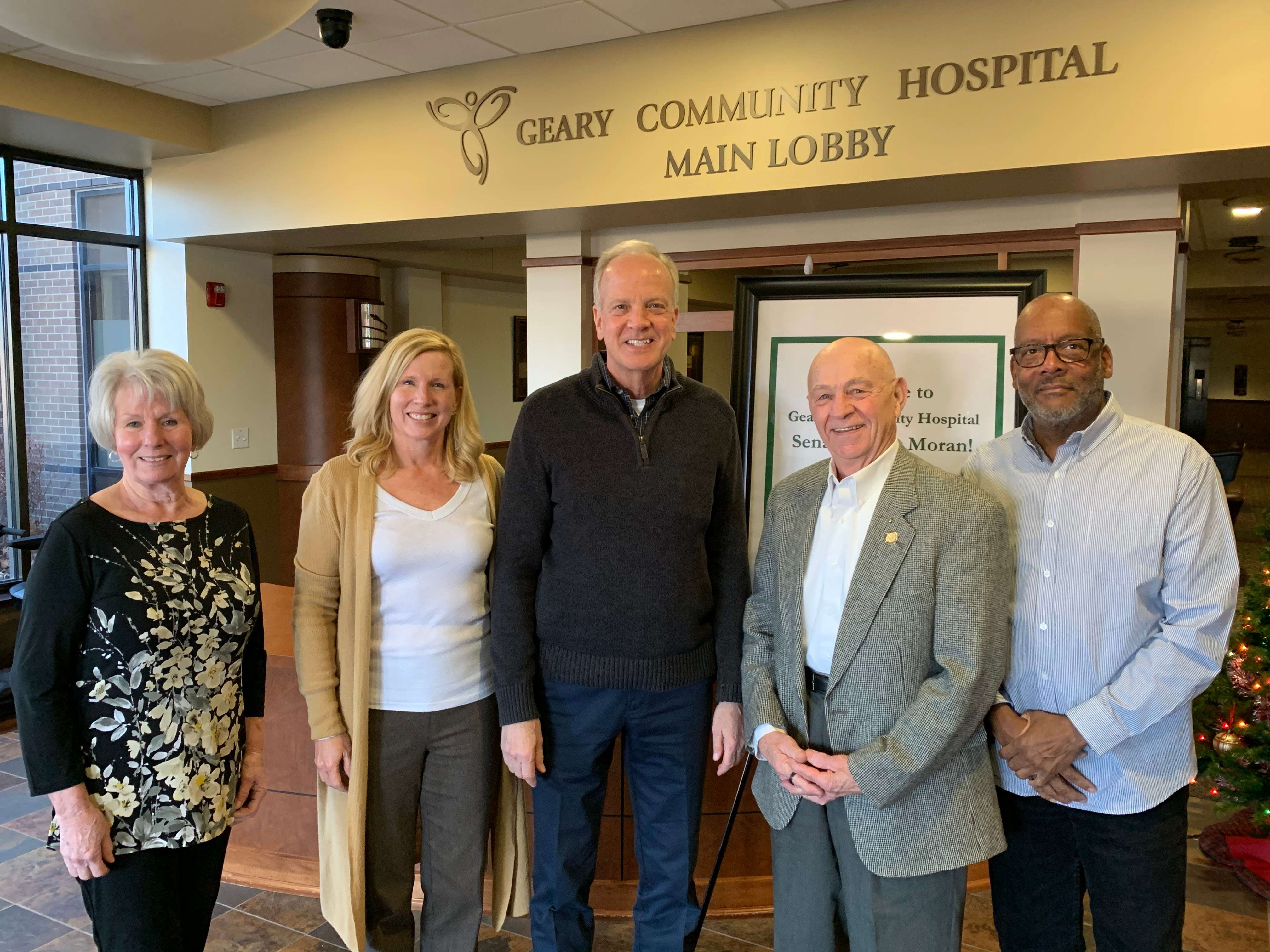 Sen. Moran ( Center ) on an earlier visit with officials at Geary Community Hospital in Junction City.