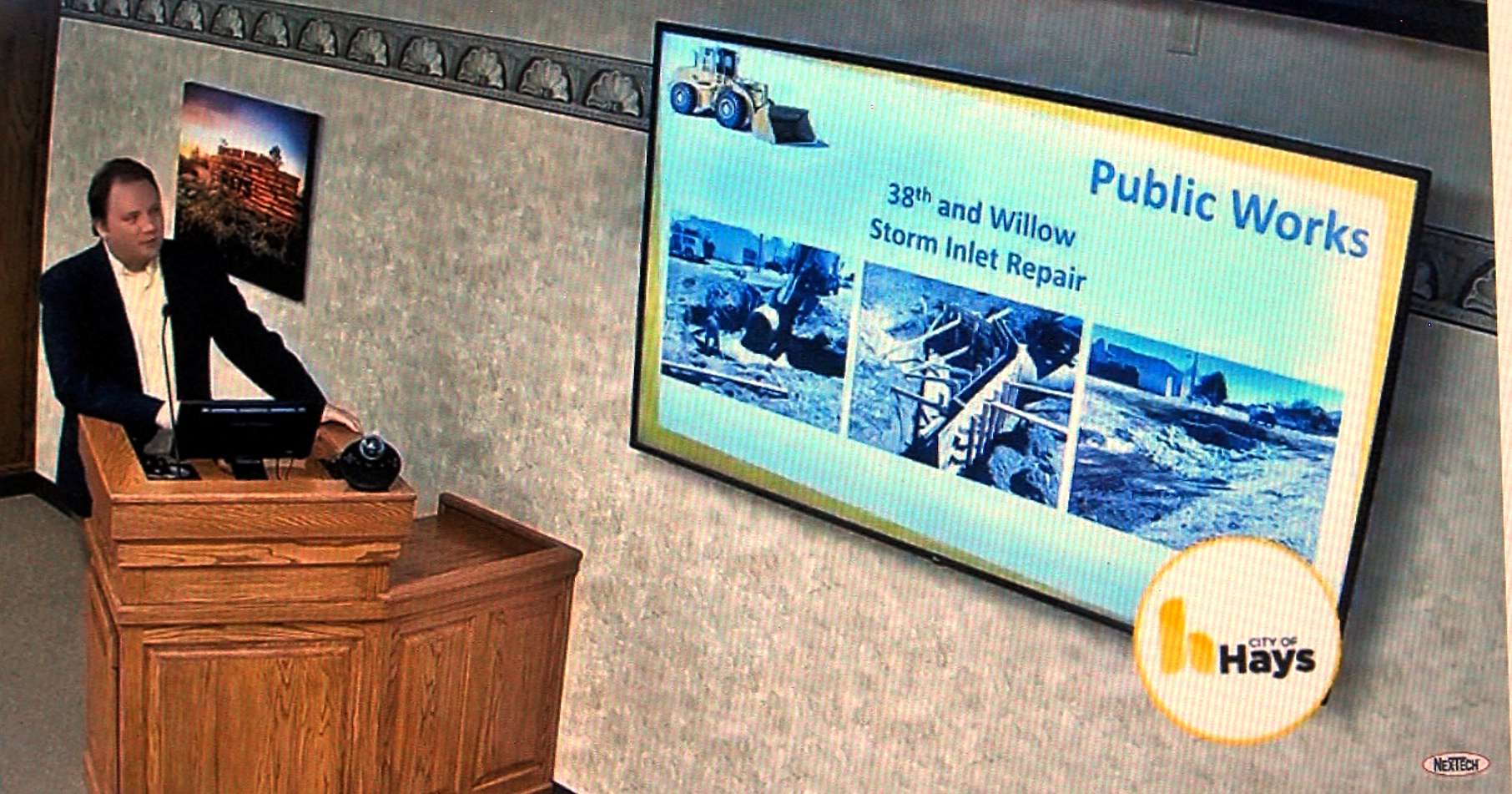 Collin Bielser, assistant Hays city manager, presents the monthly progress report at the April 23 city commission meeting.