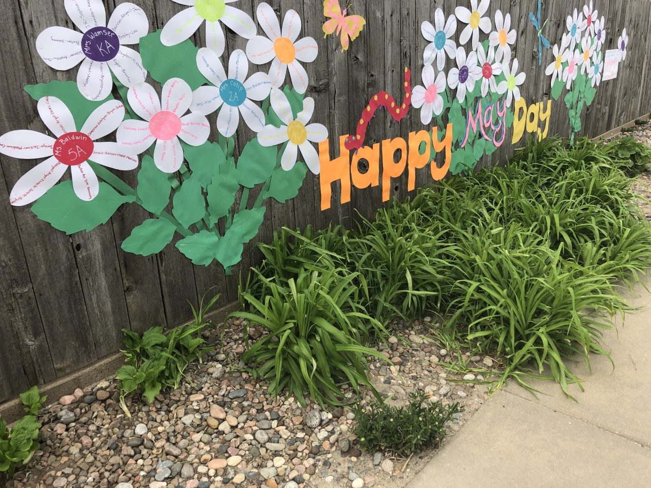 A message to her students and co-workers created by Hays USD 489 art teacher Rita Legleiter is affixed to her backyard fence on Agnes Street.