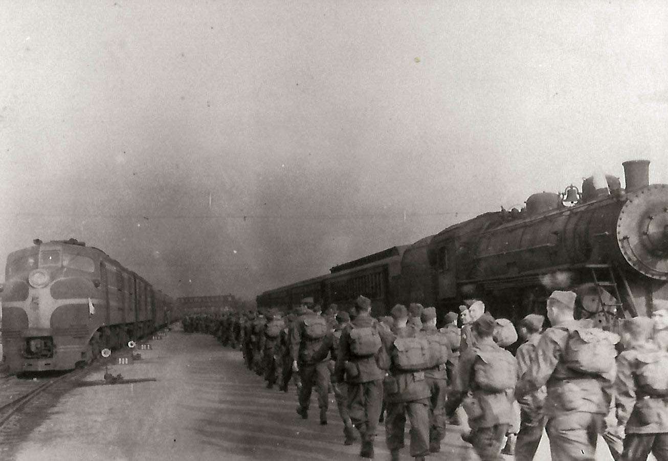 Hundreds of Soldiers prepared to board a train after vigorous training at Fort Riley in 1941. More than 125,000 Soldiers were trained at Camp Funston, Fort Riley, and sent off to combat in different theaters of World War II. Official U.S. Army photo provided by @Fort Riley Museums.