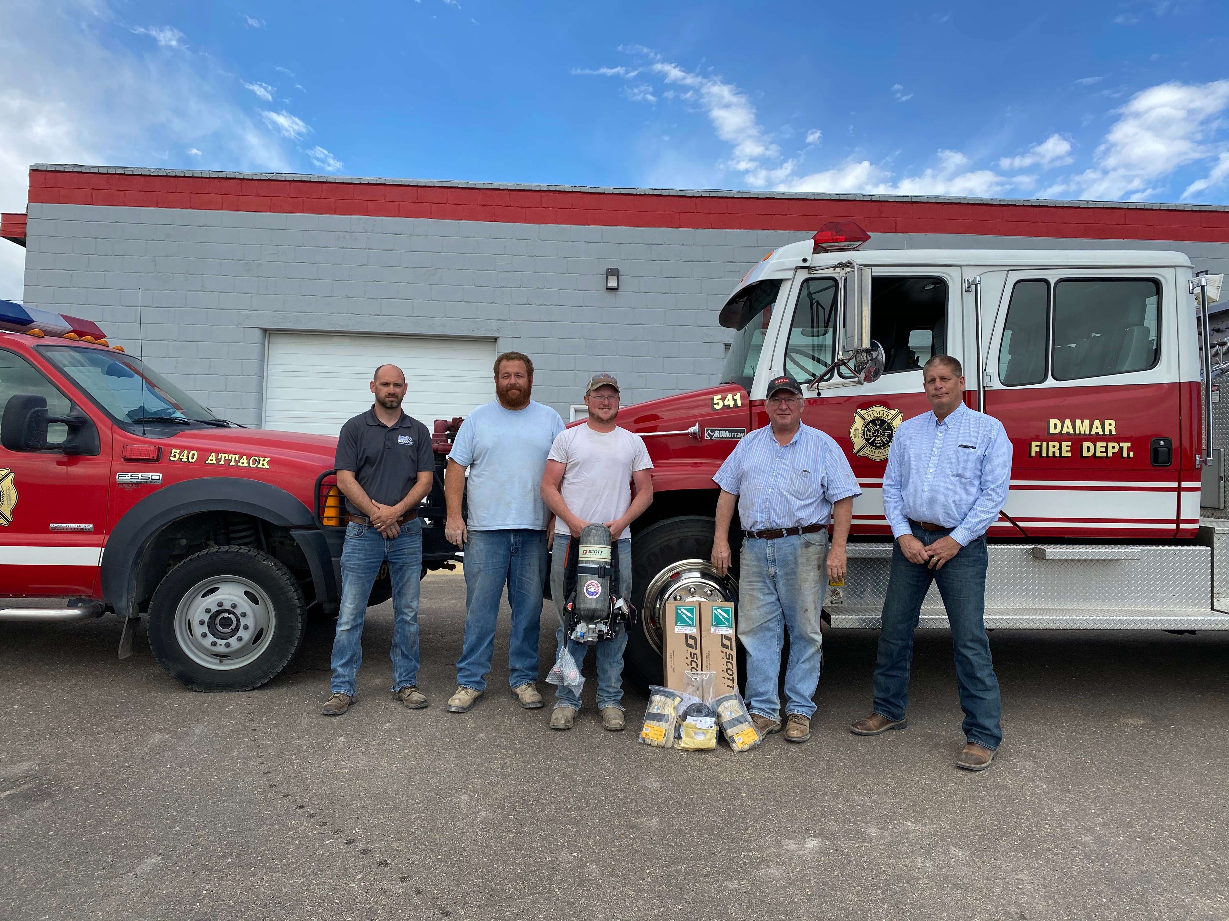 #4 Damar Fire Department l-r Shay Simoneau Midland Marketing and Damar Assistant fire chief, Matt Benoit and Kyle Benoit Damar Fire department, Tom Benoit Midland Marketing Board member, Kevin Royer GM Midland Marketing