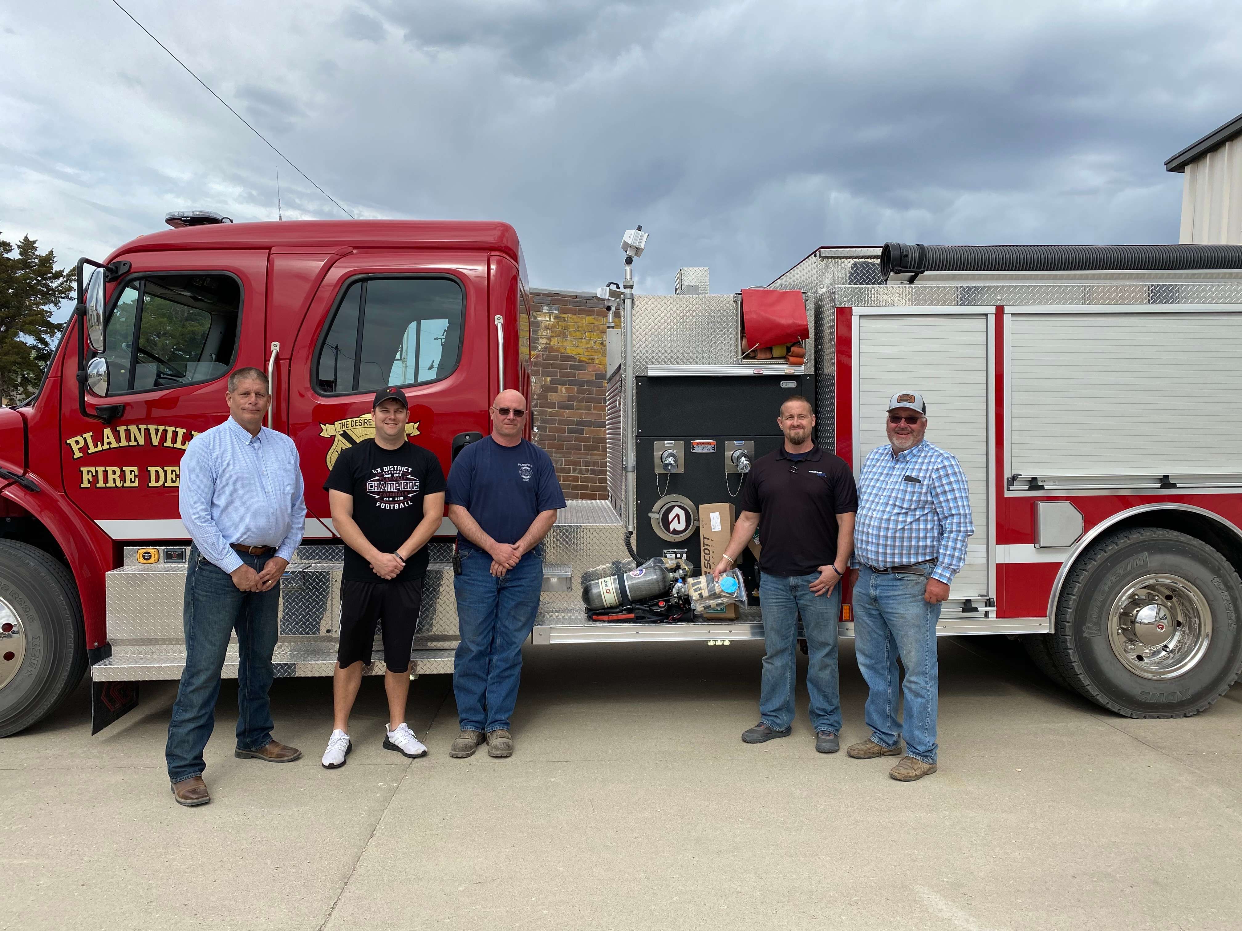 Fire Donation-Plainville Fire Department L-R Kevin Royer GM Midland Marketing and Assistant Fire Chief Plainville, Justin Casey Lieutenant, Craig Wise Plainville Fire Chief, Quinton Meyers Plainville Mayor and Fire Fighter, Doug Keas Midland Marketing Board Member.